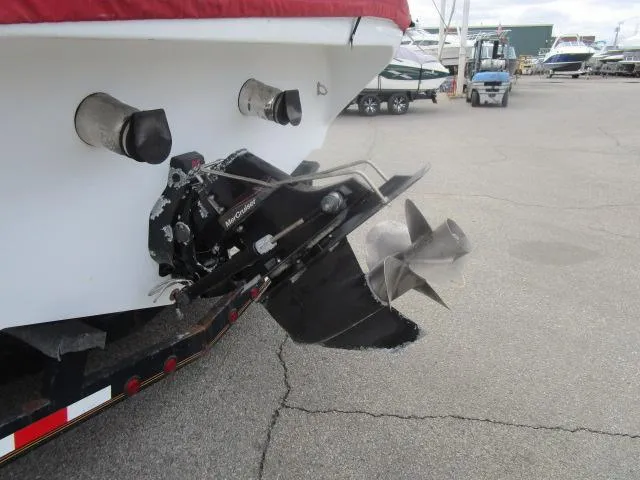 Slide: The Image of Rear view of a 2001 Baja 292 Islander boat with visible propeller and exhaust. - 4