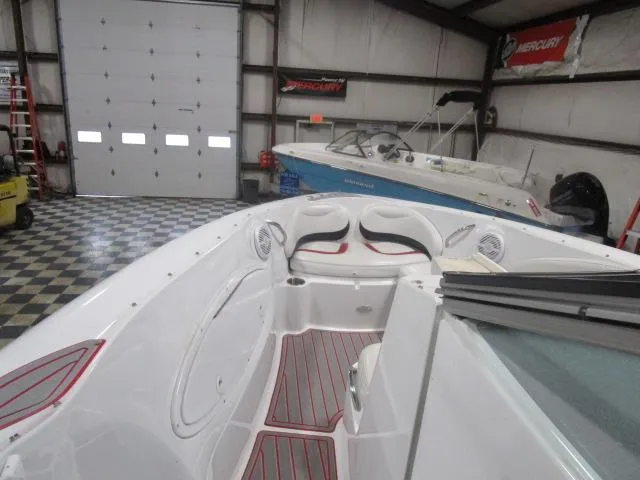 Slide: The Image of 2001 Baja 292 Islander boat in a garage with checkered flooring. - 8