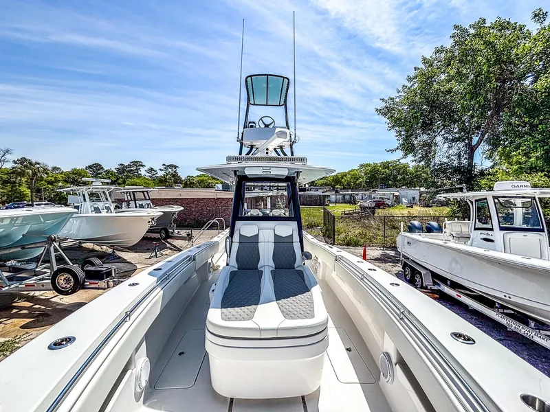 Slide: The Image of 2022 Invincible 36 Open Fisherman boat with sleek design, docked outdoors under clear sky. - 11