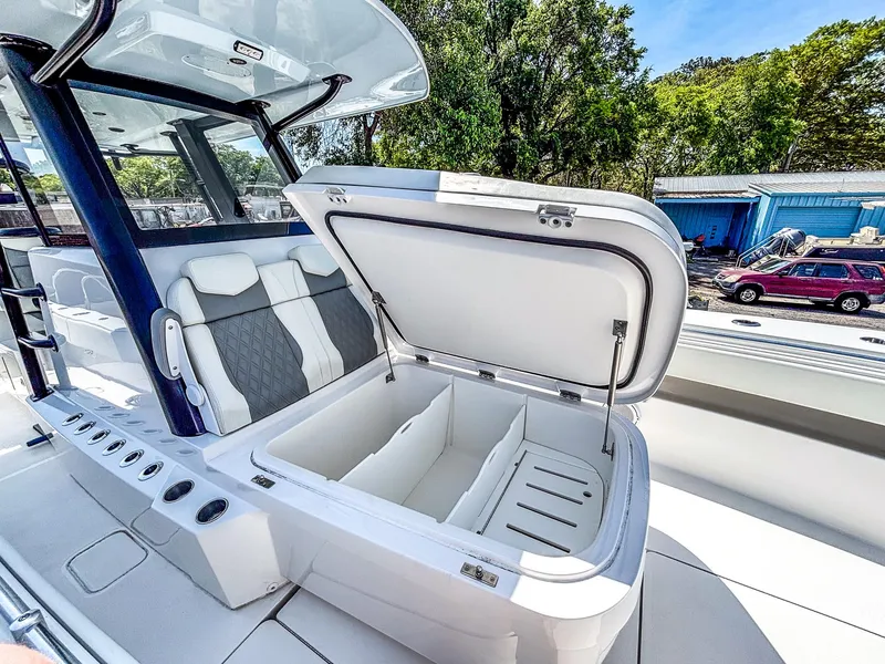 Slide: The Image of 2022 Invincible 36 Open Fisherman boat with open storage compartment and seating. - 12