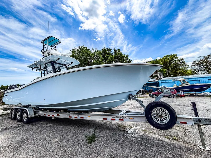 Slide: The Image of 2022 Invincible 36 Open Fisherman boat on trailer under blue sky. - 3
