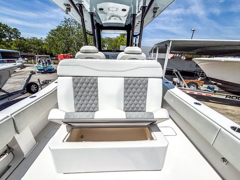 Slide: The Image of 2022 Invincible 36 Open Fisherman boat with cushioned seating and storage compartment. - 6