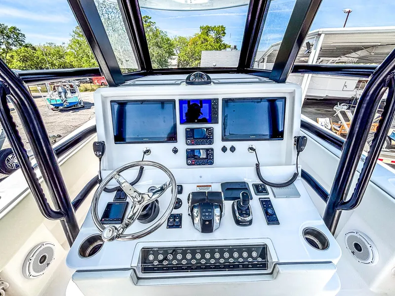Slide: The Image of 2022 Invincible 36 Open Fisherman boat dashboard with advanced navigation and control systems. - 8