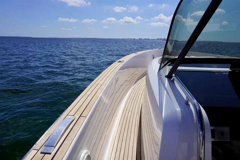 Slide: The Image of 2020 Pardo Yachts 38 cruising on open water under a clear sky. - 11