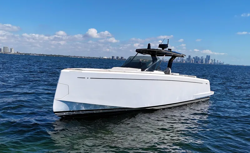 Slide: The Image of 2020 Pardo Yachts 38 cruising on open water with city skyline in background. - 4