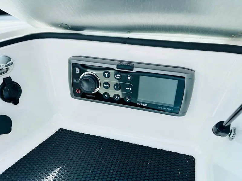 Slide: The Image of 2016 MasterCraft X30 boat audio control panel with Fusion stereo system. - 21