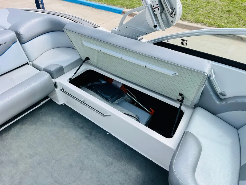 Slide: The Image of 2016 MasterCraft X30 boat interior with open storage compartment. - 26