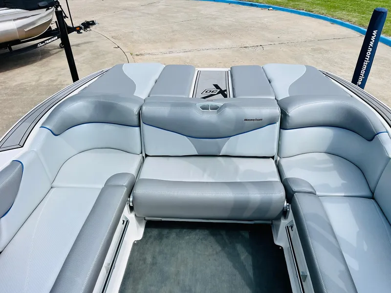 Slide: The Image of 2016 MasterCraft X30 boat interior with gray seating and sleek design. - 28