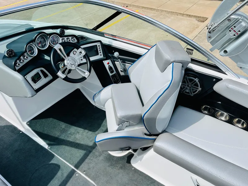 Slide: The Image of 2016 MasterCraft X30 boat interior with modern dashboard and comfortable seating. - 38