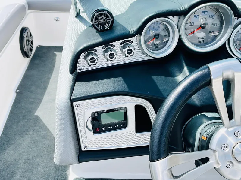 Slide: The Image of 2016 MasterCraft X30 dashboard with gauges and steering wheel. - 40
