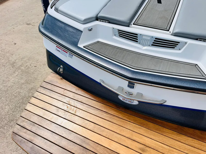 Slide: The Image of 2016 MasterCraft X30 boat rear deck with wooden platform and seating. - 48