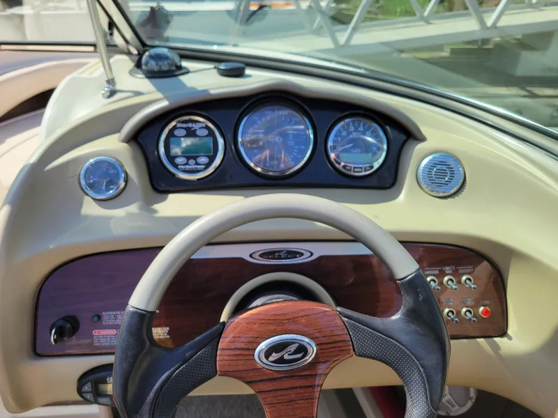 Slide: The Image of 2005 Sea Ray 200 Select dashboard with steering wheel and instrument panel. - 14