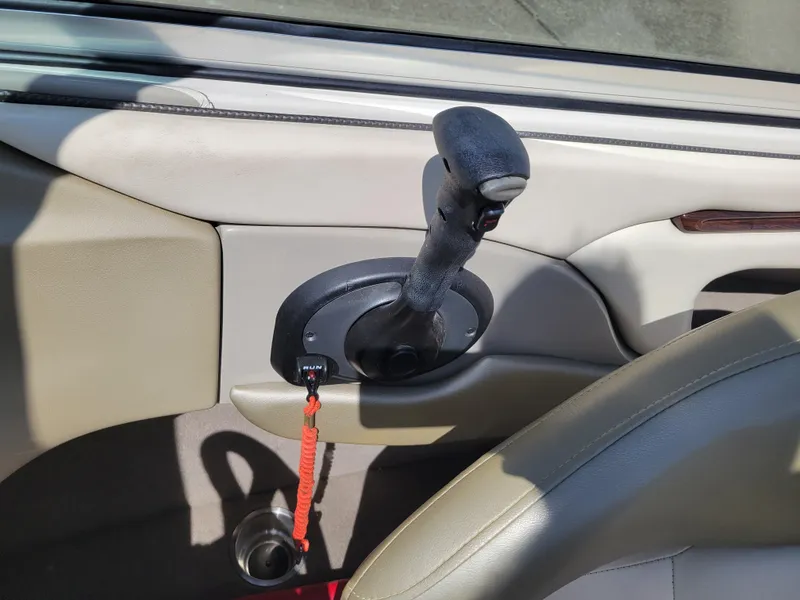 Slide: The Image of Throttle control lever in a 2005 Sea Ray 200 Select boat interior. - 17
