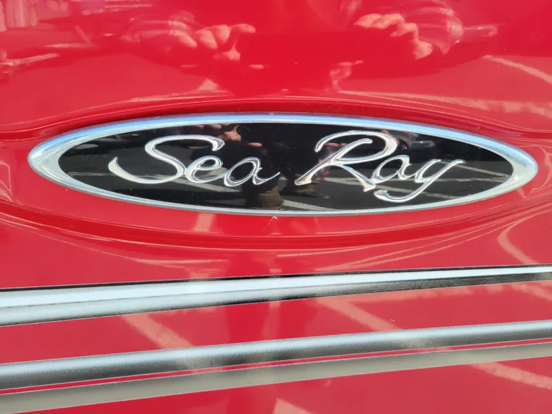 Slide: The Image of Sea Ray logo on a red 2005 Sea Ray 200 Select boat. - 21