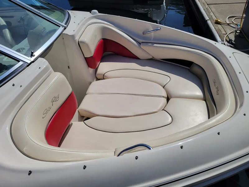 Slide: The Image of 2005 Sea Ray 200 Select boat interior with beige and red seating. - 8