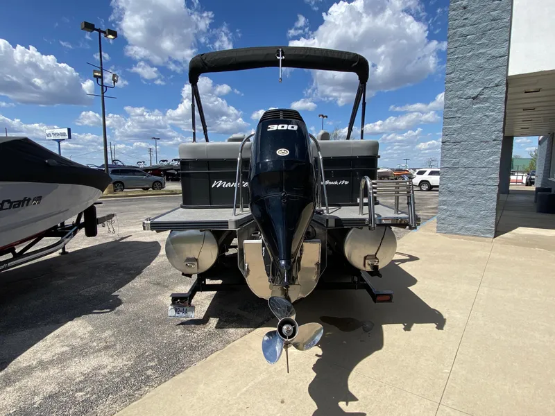 Slide: The Image of 2021 Manitou 25 Encore RF SHP Twin pontoon boat with powerful outboard motor. - 19