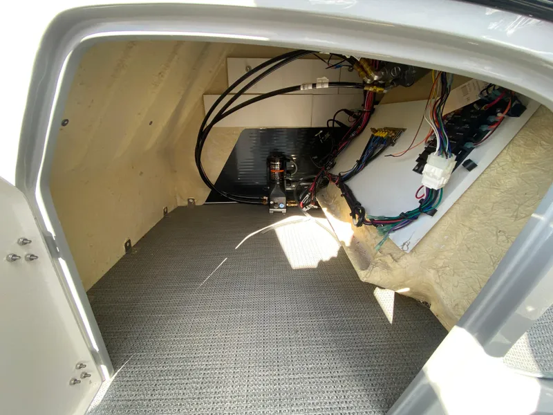 Slide: The Image of Interior view of 2021 Manitou 25 Encore RF SHP Twin boat storage compartment. - 30