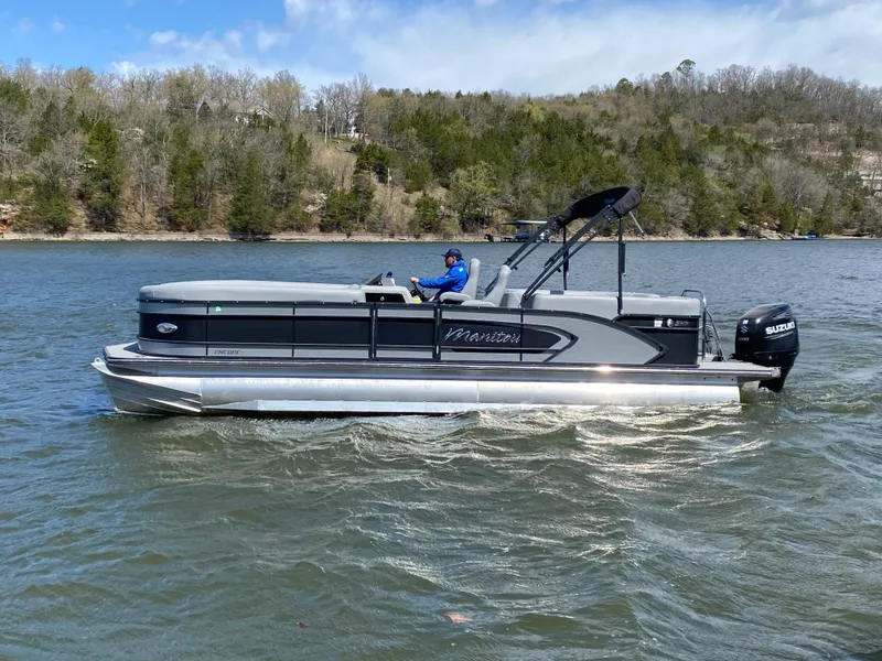 Slide: The Image of 2021 Manitou 25 Encore RF SHP Twin pontoon boat on a lake. - 4