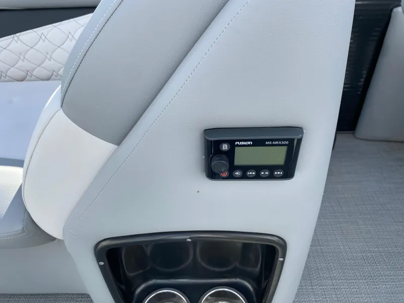 Slide: The Image of Interior of 2021 Manitou 25 Encore RF SHP Twin with control panel and cup holders. - 46