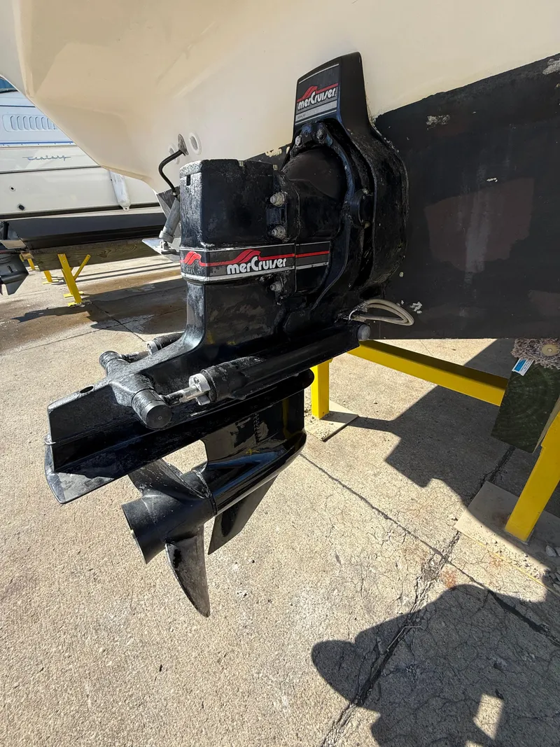 Slide: The Image of 1997 Bayliner 2655 Ciera Sunbridge with MerCruiser outdrive, displayed on a stand. - 10