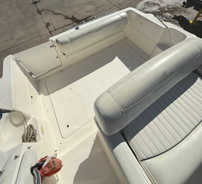 Slide: The Image of 1997 Bayliner 2655 Ciera Sunbridge boat interior with white seating and clean deck. - 14
