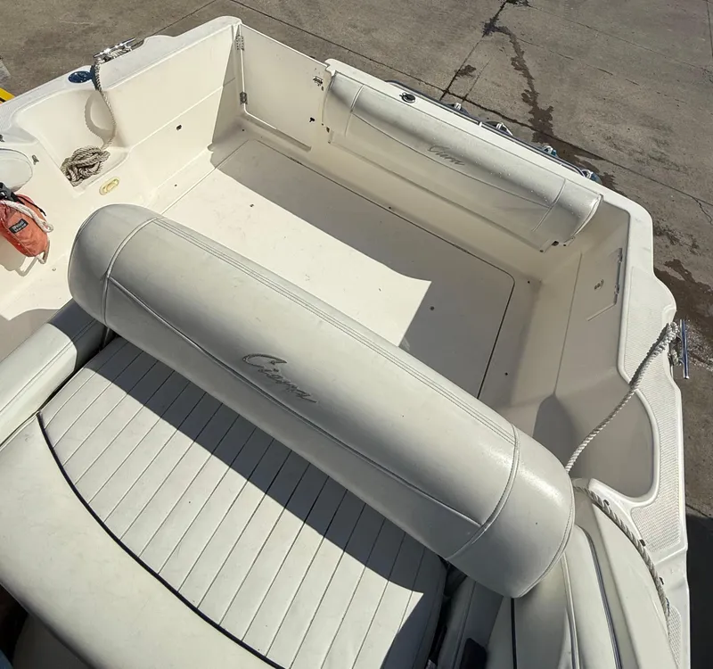 Slide: The Image of 1997 Bayliner 2655 Ciera Sunbridge boat interior with white seating and clean deck. - 15