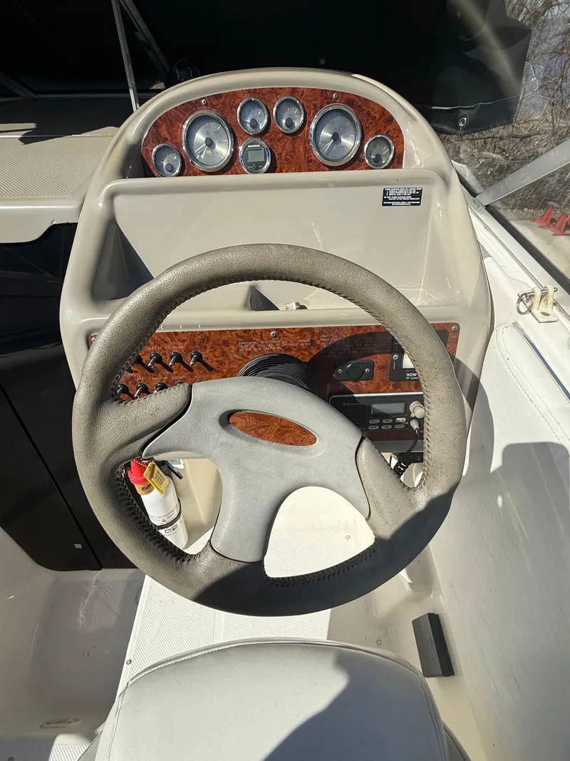 Slide: The Image of 1997 Bayliner 2655 Ciera Sunbridge dashboard with steering wheel and instrument panel. - 20