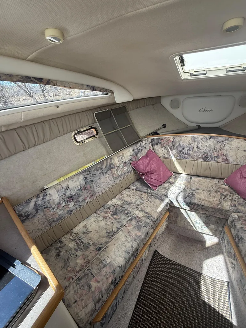 Slide: The Image of Interior of a 1997 Bayliner 2655 Ciera Sunbridge with floral seating and skylight. - 27