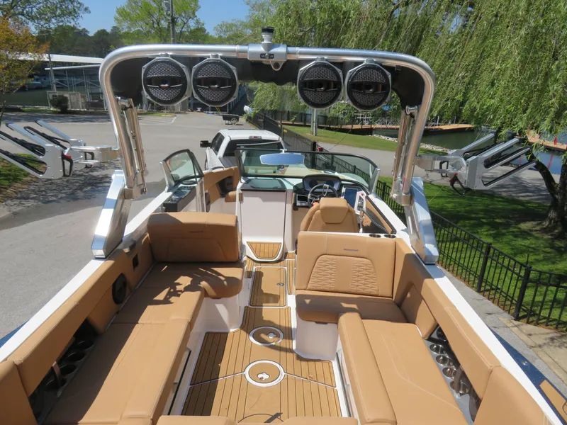 Slide: The Image of 2023 MasterCraft X26 boat with tan interior and advanced sound system. - 8