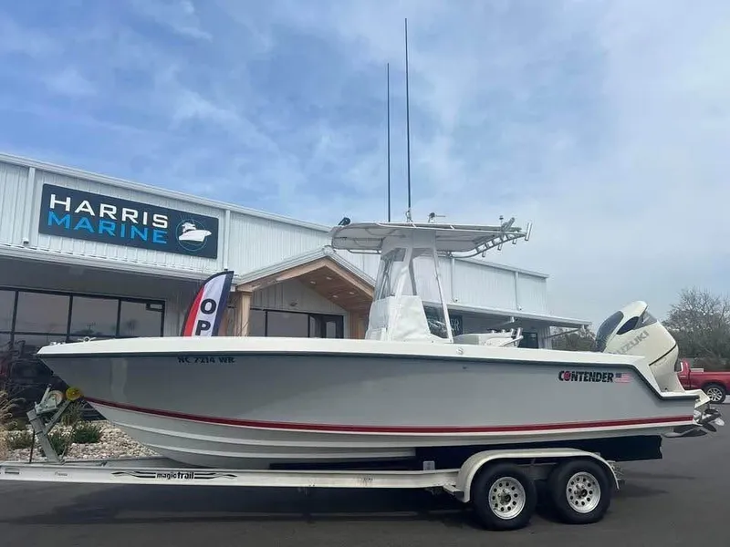 Slide: The Image of 2001 Contender 23 Open boat on trailer at Harris Marine dealership. - 0
