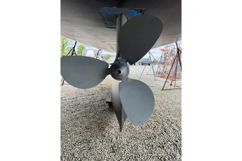 Slide: The Image of Propeller of 2022 Elan Impression 50.1 yacht on gravel surface. - 103