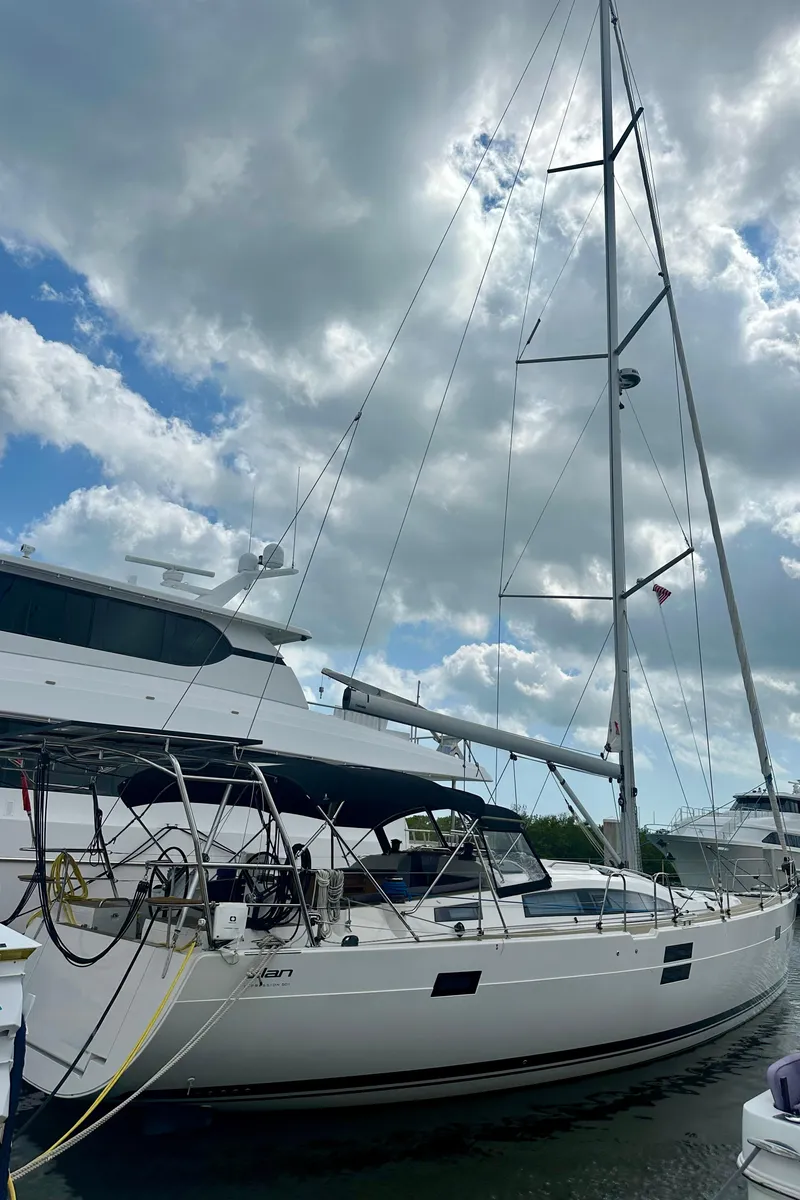 Slide: The Image of 2022 Elan Impression 50.1 sailboat docked under cloudy sky. - 11
