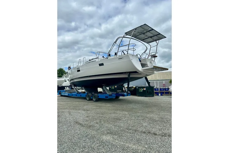 Slide: The Image of 2022 Elan Impression 50.1 yacht on trailer under cloudy sky. - 110