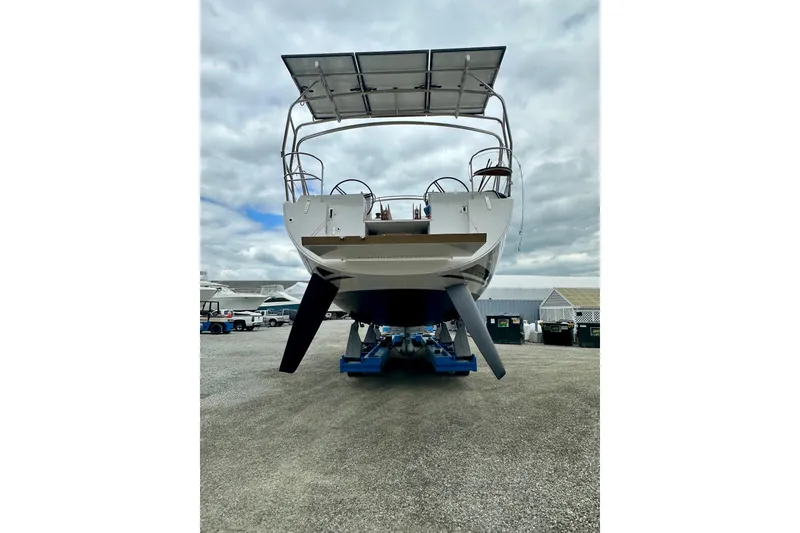 Slide: The Image of 2022 Elan Impression 50.1 yacht on display, rear view with overcast sky. - 112
