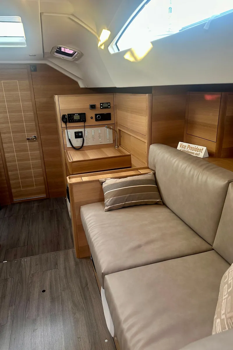 Slide: The Image of Interior of 2022 Elan Impression 50.1 yacht with modern seating and control panel. - 25