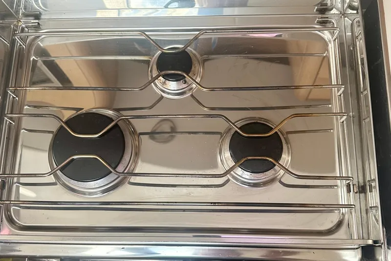 Slide: The Image of Stainless steel stove with three burners on Elan Impression 50.1 yacht, 2022 model. - 29