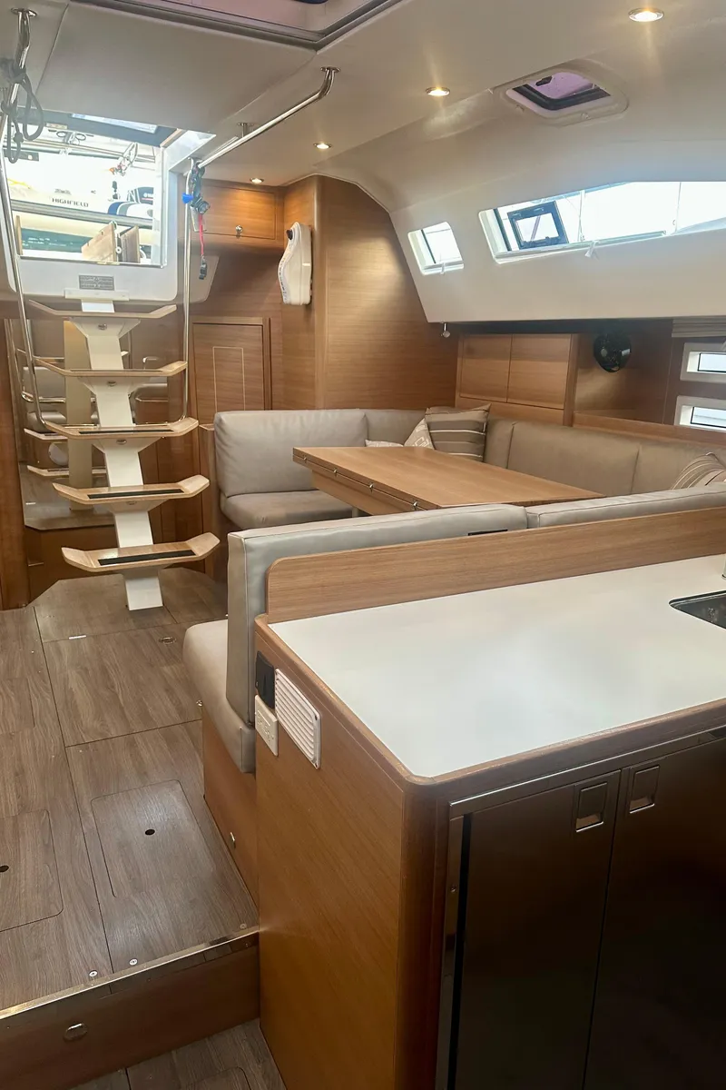 Slide: The Image of 2022 Elan Impression 50.1 yacht interior with modern seating and wooden finishes. - 32