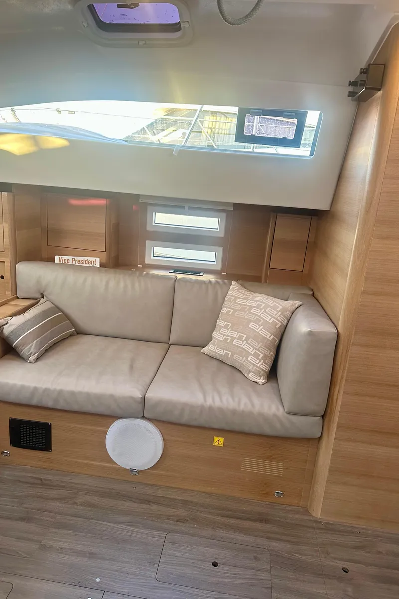 Slide: The Image of Interior of 2022 Elan Impression 50.1 yacht with modern seating and wooden accents. - 34