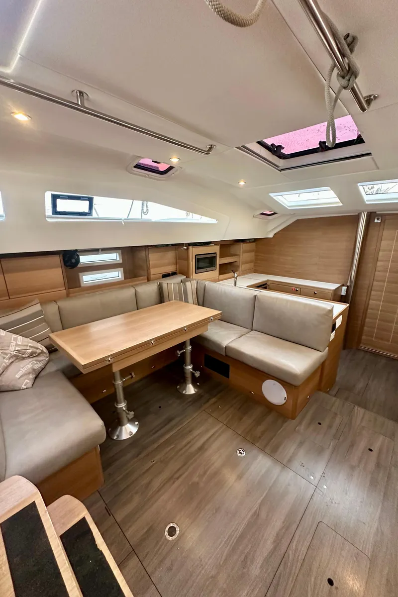 Slide: The Image of 2022 Elan Impression 50.1 yacht interior with modern seating and dining area. - 36