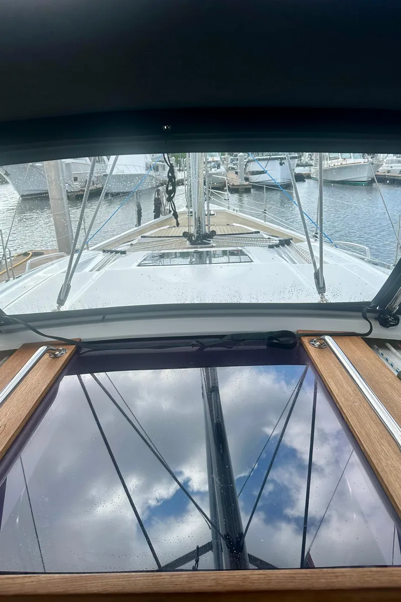 Slide: The Image of 2022 Elan Impression 50.1 yacht deck view at marina. - 49
