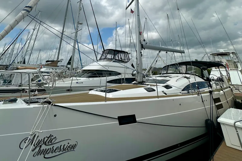 Slide: The Image of 2022 Elan Impression 50.1 yacht docked, featuring sleek design and modern amenities. - 6