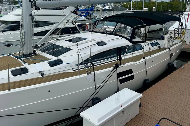 Slide: The Image of 2022 Elan Impression 50.1 yacht docked at marina, featuring sleek design and modern amenities. - 9
