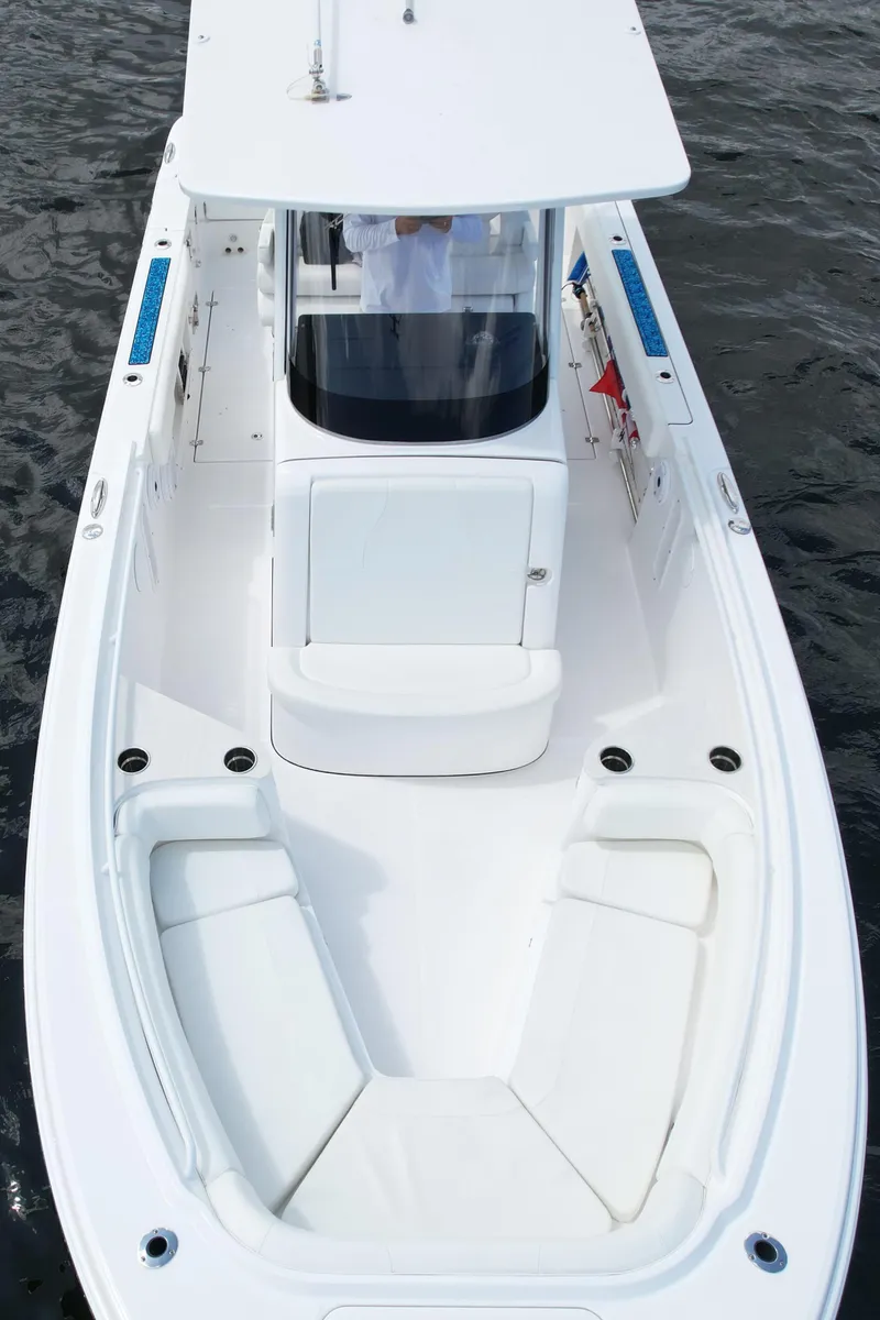 Slide: The Image of 2023 Edgewater 262CC boat, aerial view, showcasing sleek design and spacious deck. - 7