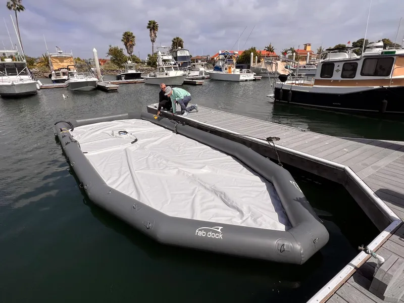 Slide: The Image of Inflatable Eco dry dock by Center Console, 2025 model, in marina setting. - 3