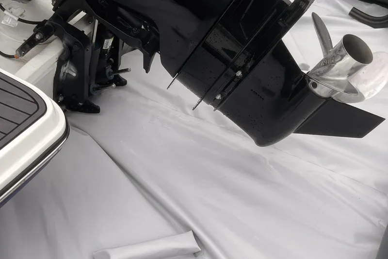 Slide: The Image of Outboard motor of 2025 Center Console Eco dry dock boat on white surface. - 8