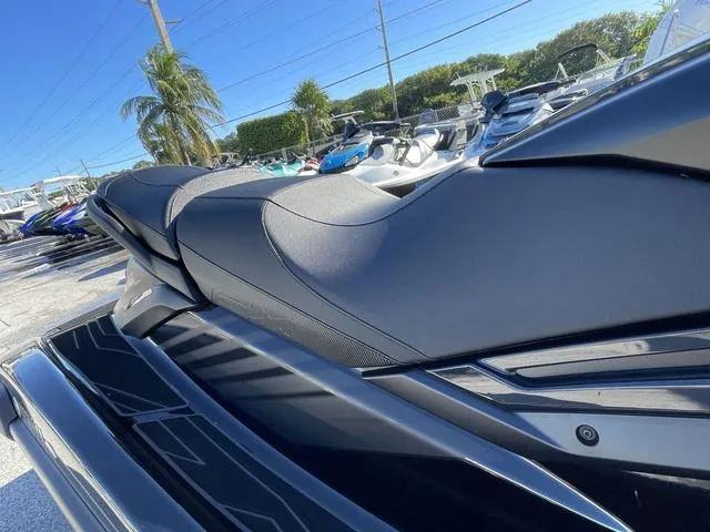 Slide: The Image of 2024 Yamaha Waverunner FX SVHO® jet ski, sleek design, parked outdoors. - 13