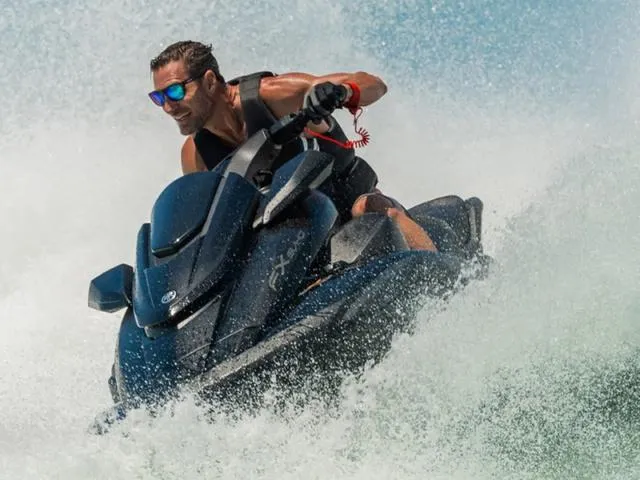 Slide: The Image of 2024 Yamaha Waverunner FX SVHO® jet ski in action on the water. - 23