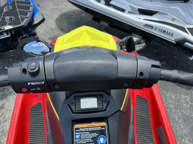 Slide: The Image of 2024 Yamaha WaveRunner EX dashboard and controls, featuring a vibrant red and yellow design. - 10