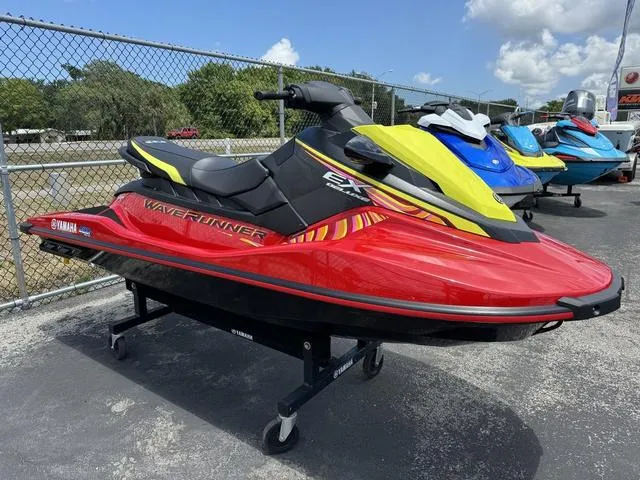 Slide: The Image of 2024 Yamaha WaveRunner EX in red and yellow, displayed outdoors on a sunny day. - 4