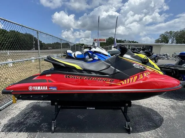 Slide: The Image of 2024 Yamaha WaveRunner EX in red, displayed outdoors on a stand. - 5